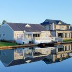 white-single-story-houses-beside-body-of-water-1438832